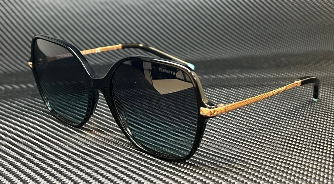 TIFFANY & Co. TF4191 Oversized Black Blue Gradient Women's Sunglasses 57mm: TIFFANY & Co. TF4191 Oversized Black Blue Gradient Women's Sunglasses 57mm Stylish oversized women's sunglasses by TIFFANY & Co. featuring a sleek black frame with a blue gradient lens. Designed for b
