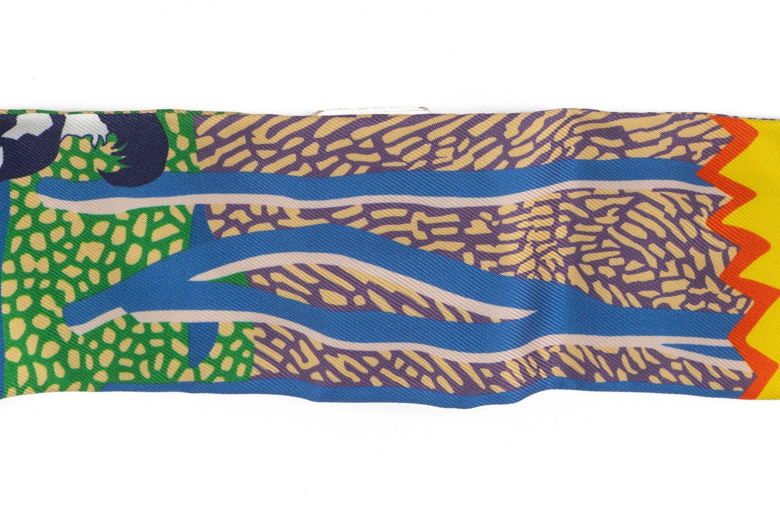 Hermes En Liberte Silk Twilly Scarf 2 inches x 34 inches Colorful Abstract Design: Hermes En Liberte Silk Twilly Scarf 2 inches x 34 inches Colorful Abstract Design This Hermes "En Liberte" silk twilly features a vibrant, abstract design with a dog illustration. It measures 2 in hei