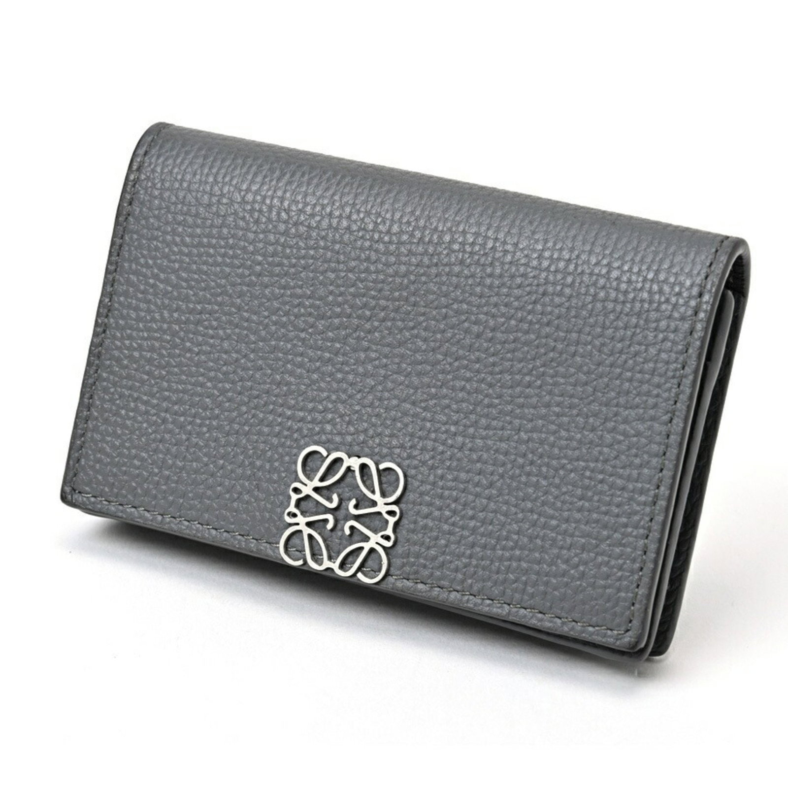 Loewe Grey Calfskin Card Holder Case 7cm x 10.8cm for Women: Loewe Grey Calfskin Card Holder Case 7cm x 10.8cm for Women This Loewe card holder case is crafted from high-quality pebble grain calfskin leather in a sophisticated gray color. Designed for women, it