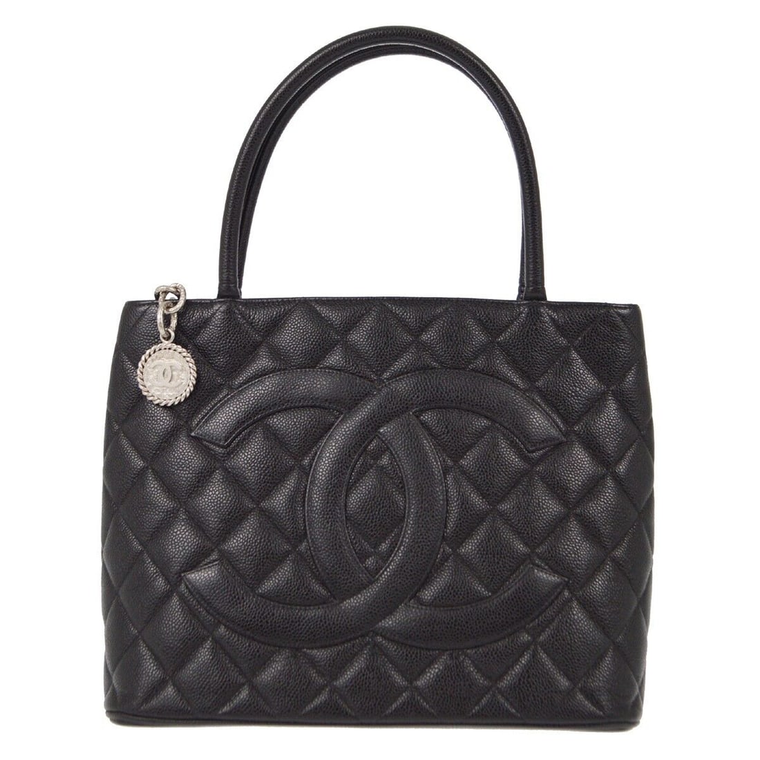 Chanel Black Caviar Medallion Tote Handbag: Chanel Black Caviar Medallion Tote Handbag This Chanel Black Caviar Medallion Tote Handbag features a luxurious exterior made from caviar skin leather in a classic black color. The bag measures 12 inc