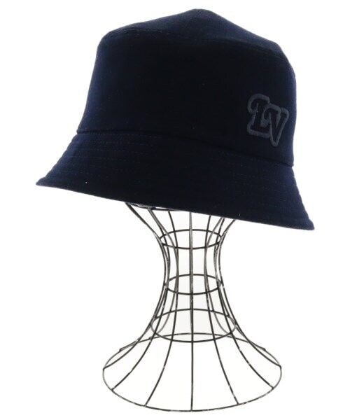 Louis Vuitton Navy Fedora Hat with Logo: Louis Vuitton Navy Fedora Hat with Logo This stylish navy fedora hat features a prominent logo on the front. Ideal for adding a touch of luxury to any outfit. Specifications Style: Fedora Color: Navy