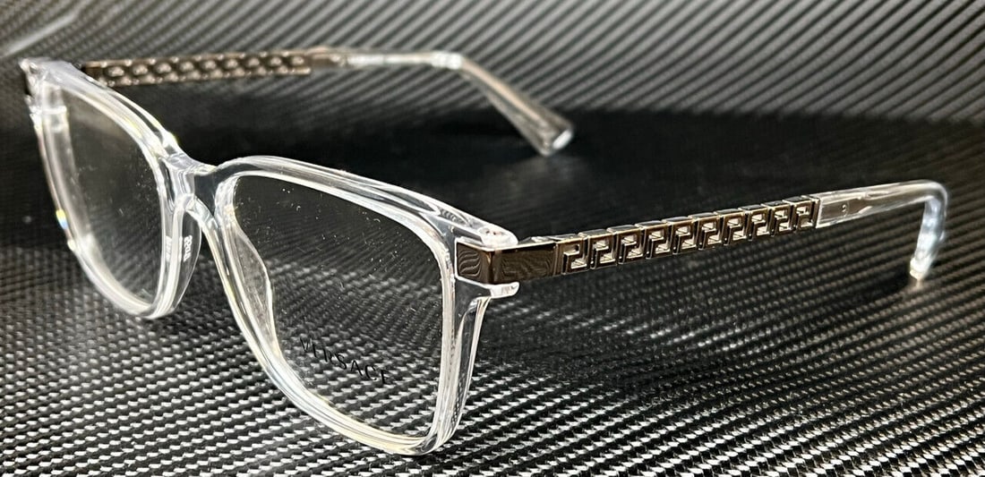 Versace VE3340U 148 Clear Eyeglasses for Men 55mm: Versace VE3340U 148 Clear Eyeglasses for Men 55mm Discover the Versace VE3340U 148 eyeglasses, featuring a sleek clear frame designed for men. These eyeglasses showcase decorative metal accents on the