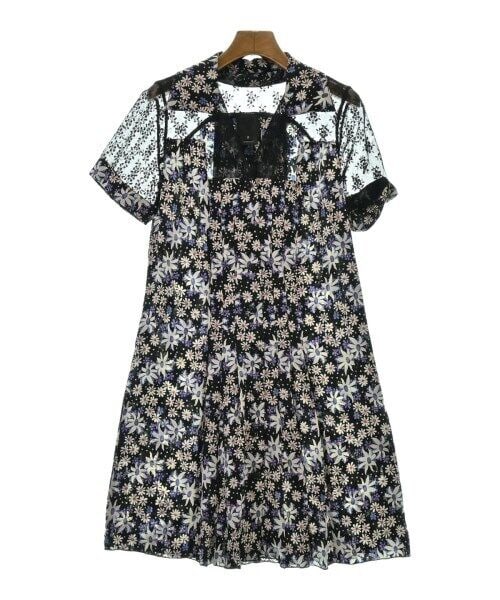Anna Sui Floral Print Dress in Black, White, and Blue, Size 2 (Medium): Anna Sui Floral Print Dress in Black, White, and Blue, Size 2 (Medium) This beautiful Anna Sui dress features a vibrant floral pattern in black, white, and blue. It is designed as a one-piece garment