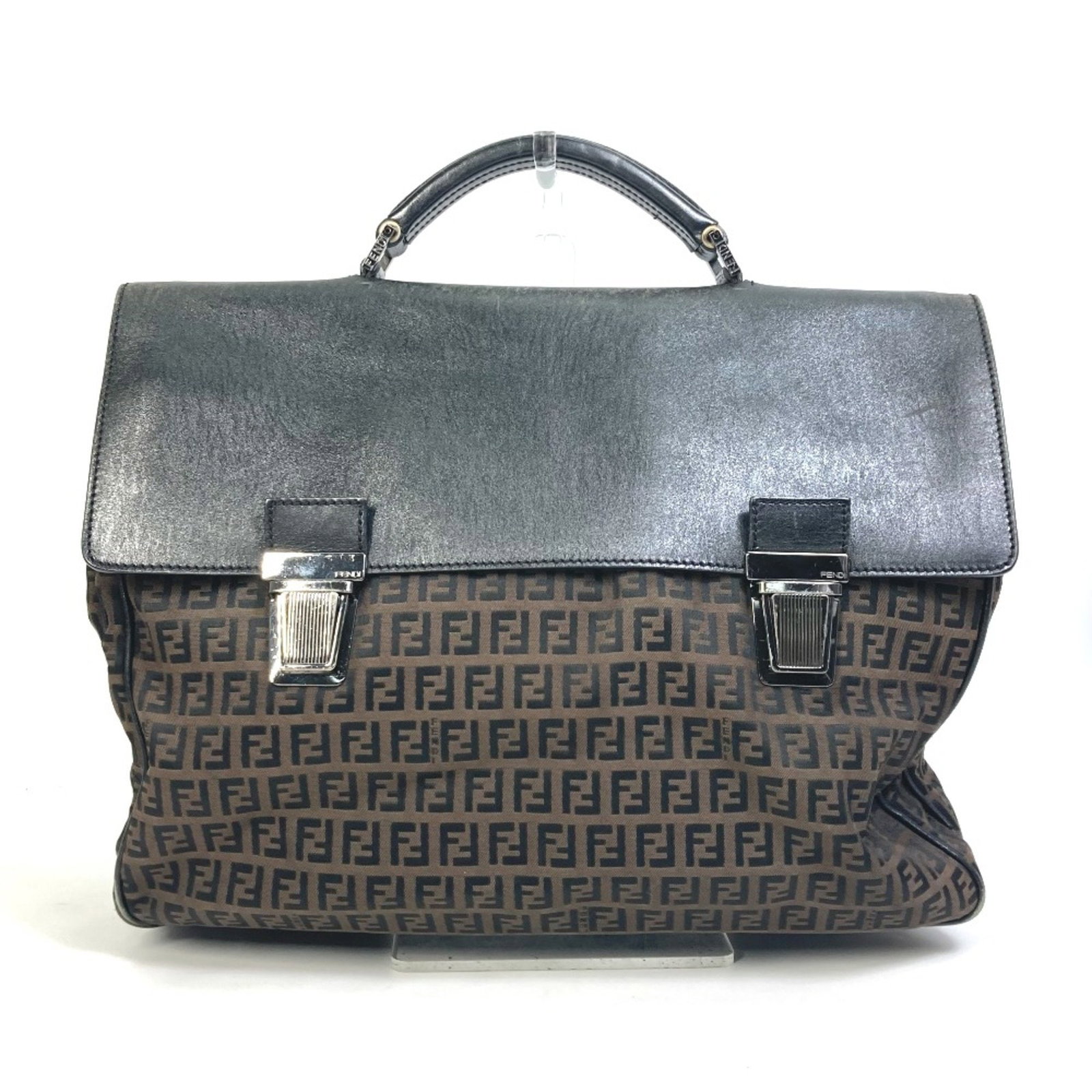Fendi Vintage Brown Black Briefcase for Men: Fendi Vintage Brown Black Briefcase for Men This Fendi vintage briefcase is made of quality cloth and features a stylish brown and black color scheme. Designed specifically for men, it measures W37.5c