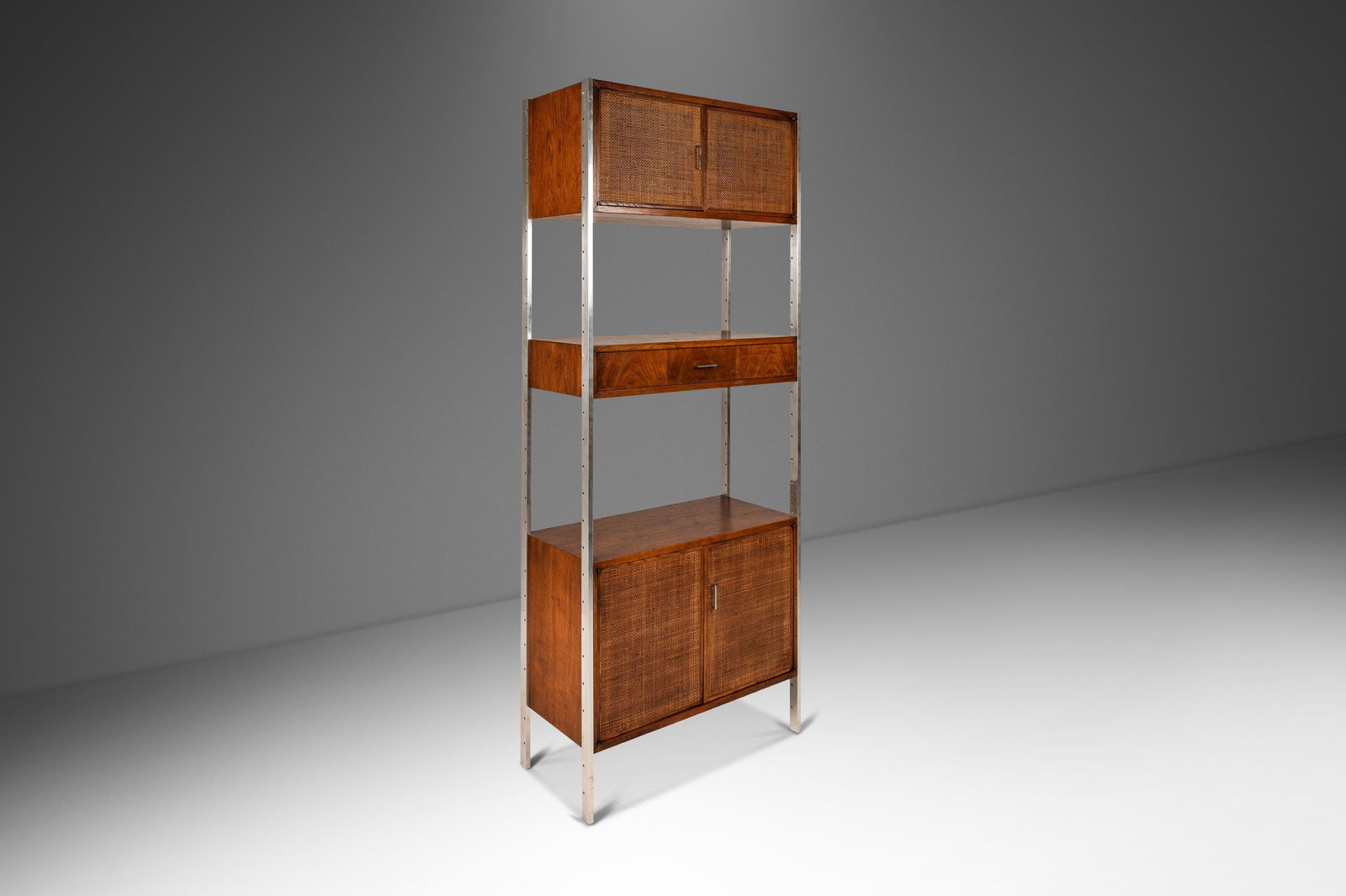 Jack Cartwright Mid-Century Modern Walnut Steel Wall Unit 1960s: Jack Cartwright Mid-Century Modern Walnut Steel Wall Unit 1960s Mid-Century Modern Wall Unit / Bookcase / Display Cabinet in Walnut & Stainless Steel by Jack Cartwright for Founders USA c. 1960s. Abou