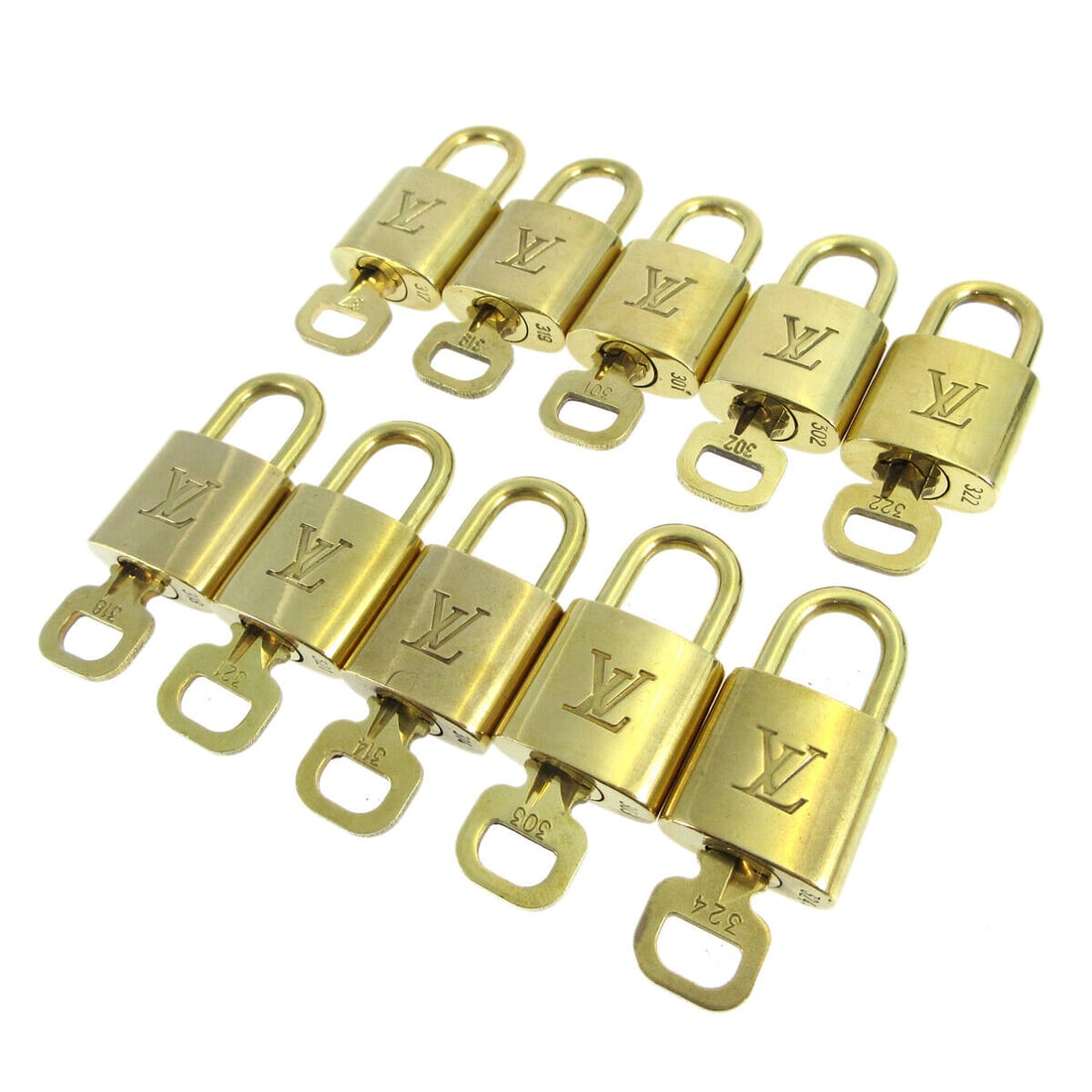 Louis Vuitton 10 Piece Gold Padlock and Key Bag Accessories Charm Set: Louis Vuitton 10 Piece Gold Padlock and Key Bag Accessories Charm Set This Louis Vuitton 10 piece set features gold-tone padlock and key bag accessories, perfect for enhancing your bags. The set showc
