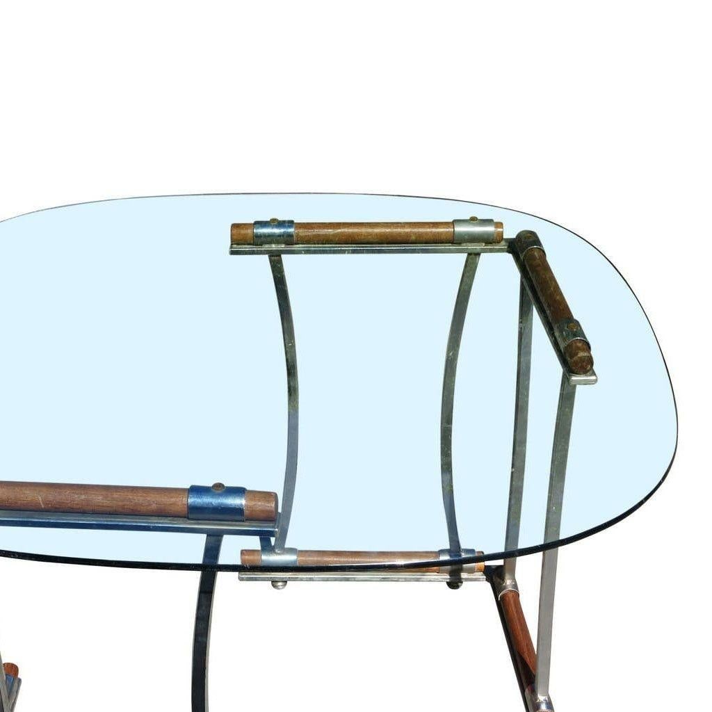 Cleo Baldon Chrome Dining Set Post-Modern Style 1970s: Cleo Baldon Chrome Dining Set Post-Modern Style 1970s This Chrome Dining Chair and Dining Table Set, designed by Cleo Baldon, features a sleek and modern aesthetic characteristic of the Post-Modern st