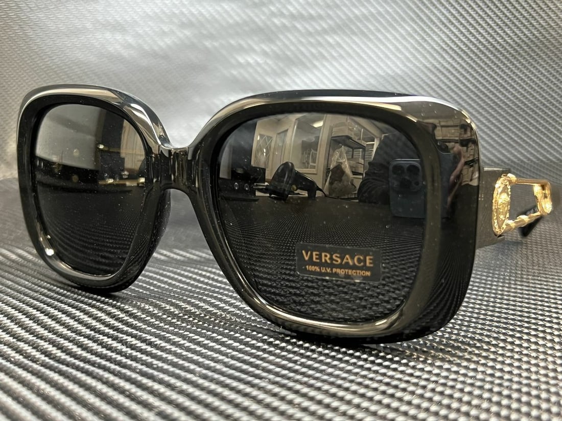 VERSACE VE4411 Women's Sunglasses Black Square 54mm: VERSACE VE4411 Women's Sunglasses Black Square 54mm Elevate your accessory collection with these VERSACE VE4411 GB1 87 Women's Sunglasses. The frame is elegantly designed in a classic black color, fea