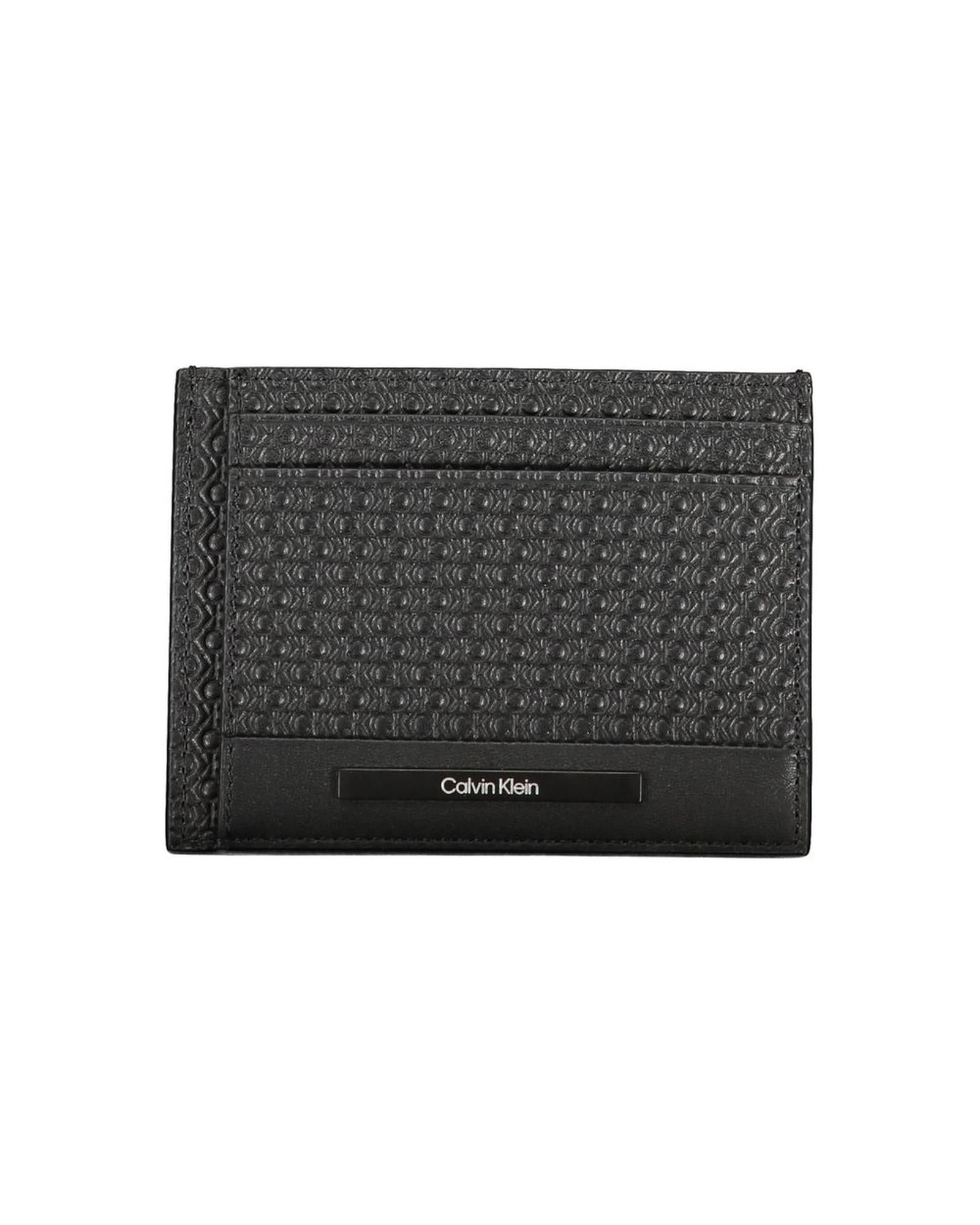Calvin Klein Calvin Klein Mens Black Card Case: Calvin Klein Calvin Klein Mens Black Card Case This black leather wallet is a must-have accessory for any stylish man. With a card holder 2 side compartments and 1 central pocket there is ample space