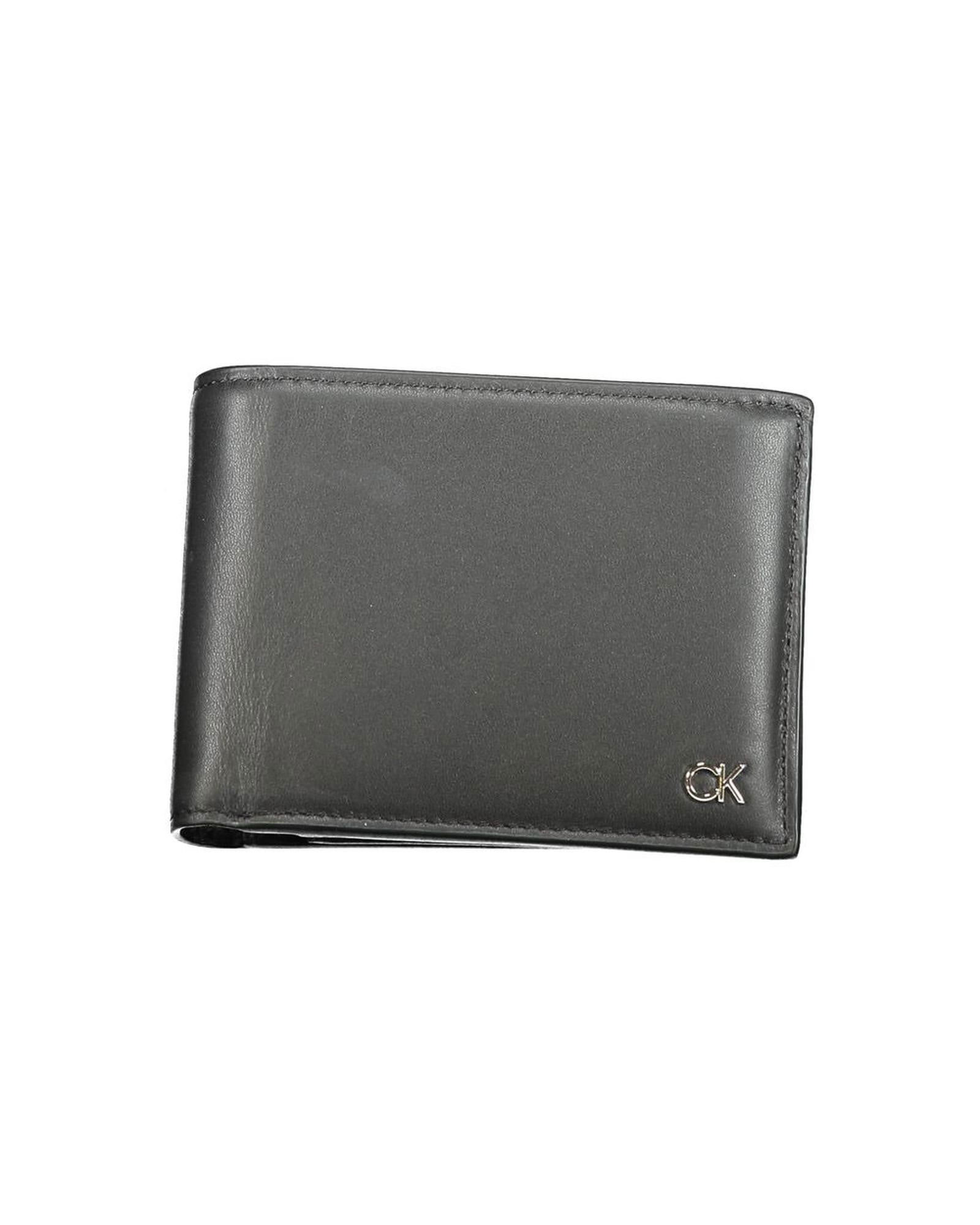 Calvin Klein Calvin Klein Mens Slim Leather Wallet: Calvin Klein Calvin Klein Mens Slim Leather Wallet This black leather wallet is a sophisticated accessory designed for men. Crafted from high-quality leather it features multiple compartments to keep