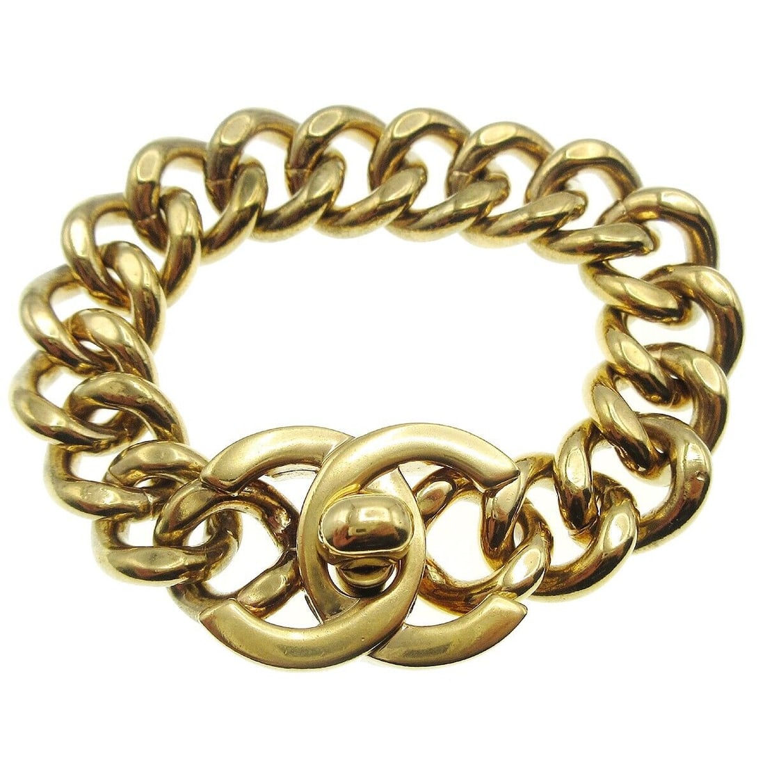 CHANEL Gold-Plated CC Turnlock Charm Chain Bracelet 7.5 Inches: CHANEL Gold-Plated CC Turnlock Charm Chain Bracelet 7.5 Inches This CHANEL CC Turnlock Motif Charm Gold Chain Bracelet features a classic chain style, crafted from gold-plated material. The bracelet m