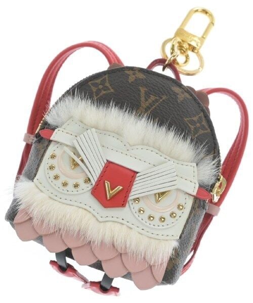 LOUIS VUITTON Charm Brown White Pink Unique Luxury: LOUIS VUITTON Charm Brown White Pink Unique Luxury This LOUIS VUITTON charm features a unique color combination of brown, white, and pink. It is designed to enhance your accessories and add a touch of