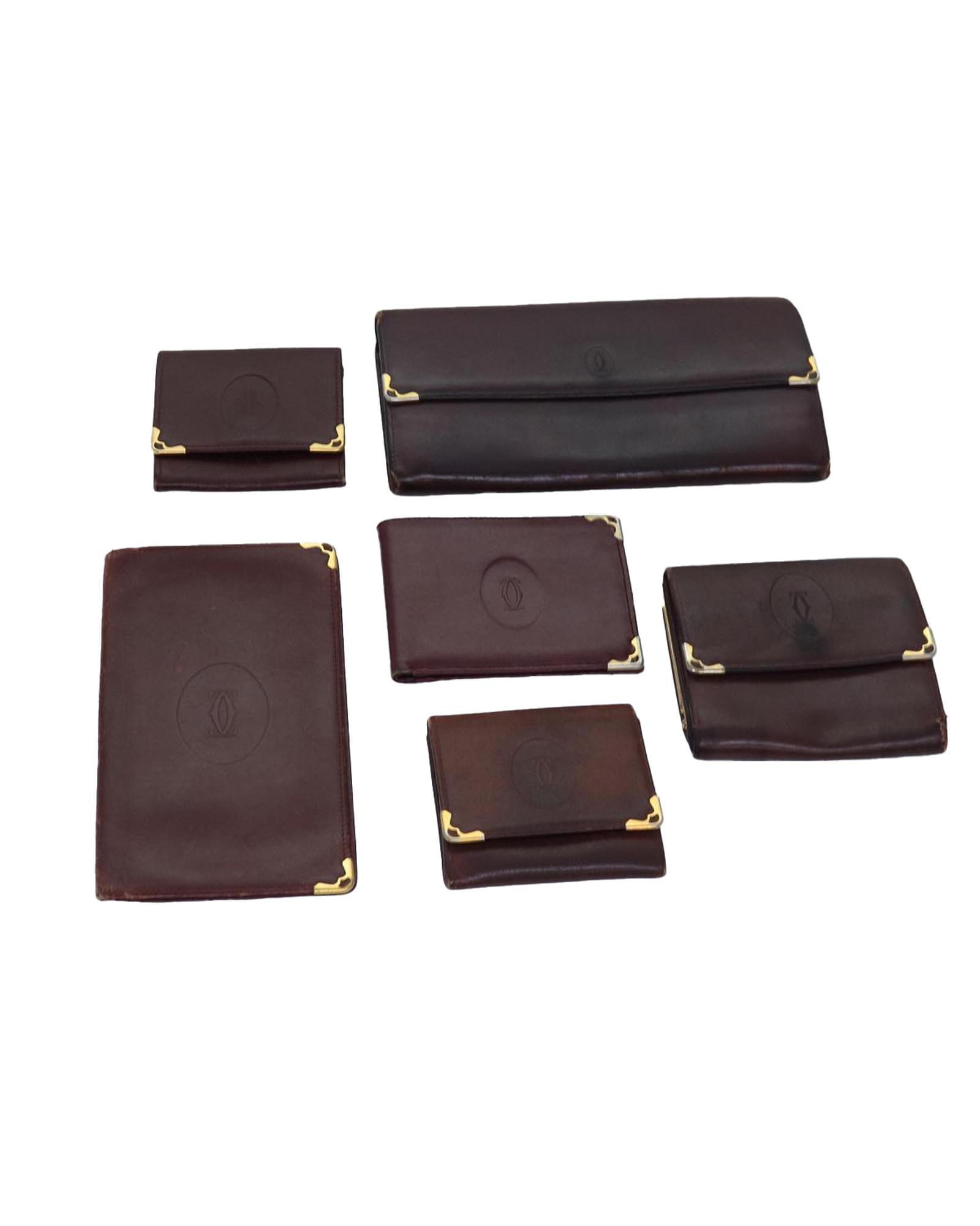 Cartier Leather Card Case Wallet with Clasp Button and Zipper Pull: Cartier Leather Card Case Wallet with Clasp Button and Zipper Pull The Cartier Card Case Wallet is a luxurious and stylish accessory crafted from high-quality red leather. This wallet is designed for 