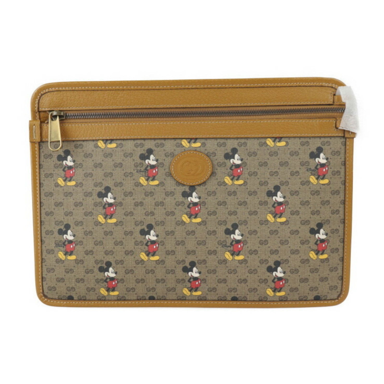 GUCCI Disney Mickey Mini Clutch Pouch GG Supreme Brown: GUCCI Disney Mickey Mini Clutch Pouch GG Supreme Brown This GUCCI bag is a collaboration with Disney, featuring the iconic Mickey Mouse design. It is a mini clutch pouch crafted from GG Supreme canvas