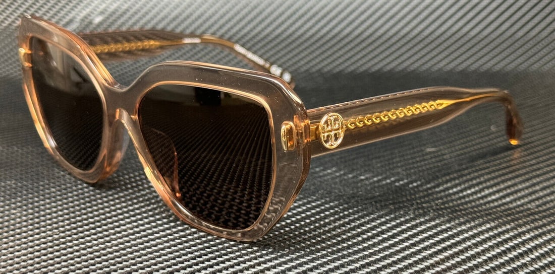 Tory Burch 55mm Transparent Brown Women's Sunglasses: Tory Burch 55mm Transparent Brown Women's Sunglasses Stylish and modern, these TORY BURCH TY7194U sunglasses feature a transparent brown frame with a sleek design. Perfect for adding a touch of elegan