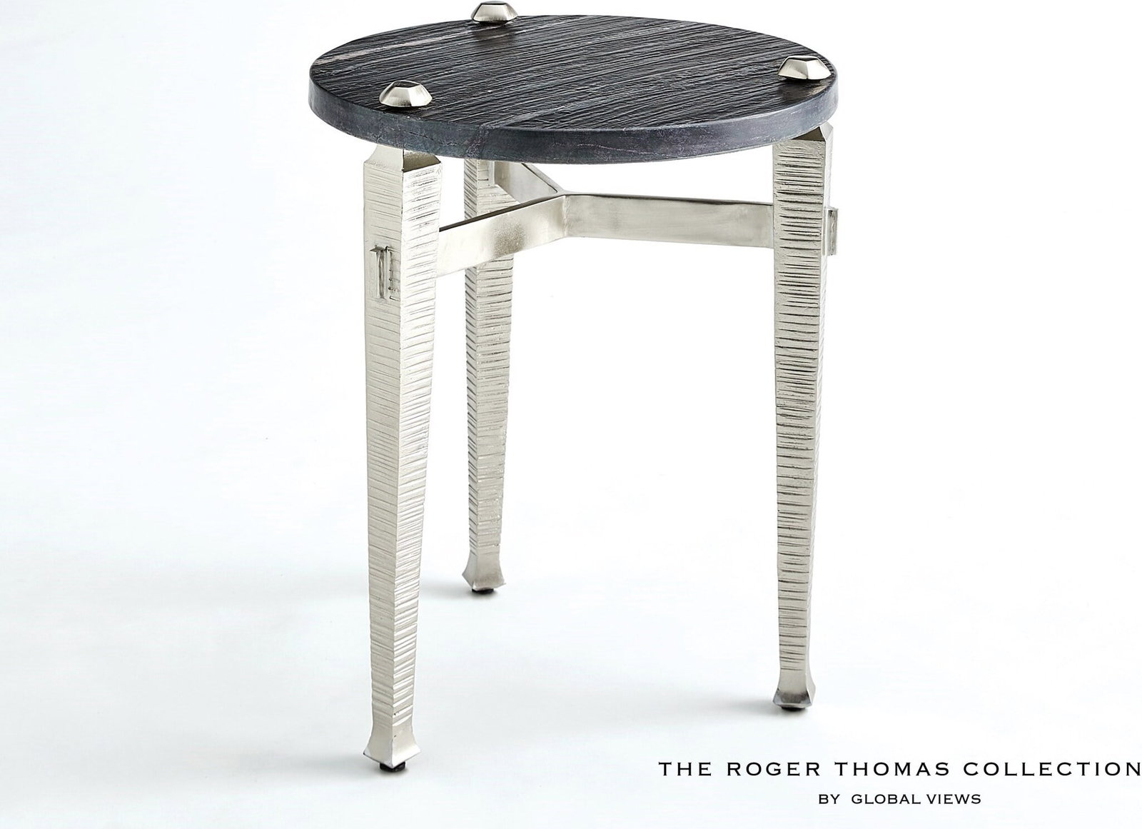 Roman Drinks Table In Nickel: Roman Drinks Table In Nickel The Roman collection by Roger Thomas draws inspiration from two notable sources. The silhouette of the leg was inspired by pieces crafted by Thomas Chippendale. The horizo