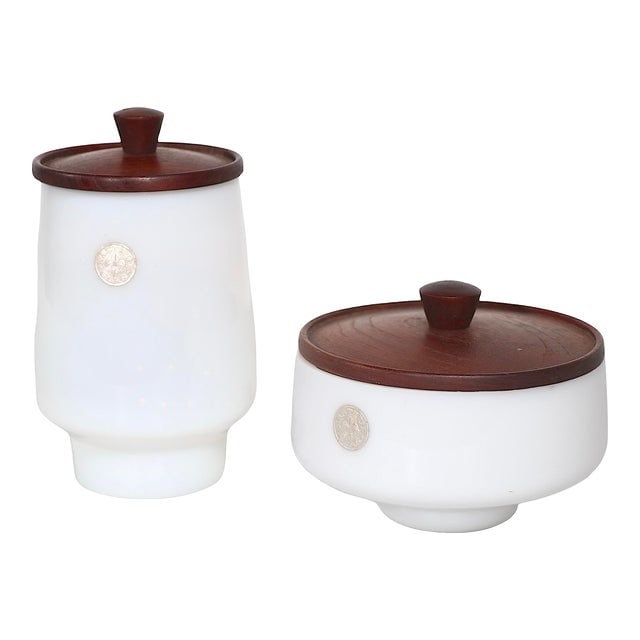 2 Pc. Opaline Glass and Teak Katstrup Vessels by Jacob Bang Imported by Raymor C 1950's: 2 Pc. Opaline Glass and Teak Katstrup Vessels by Jacob Bang Imported by Raymor C 1950's Both are in excellent original condition free of damage or repairs. Dimensions: 4"W x 4"D x 7"H Styles: Danish M
