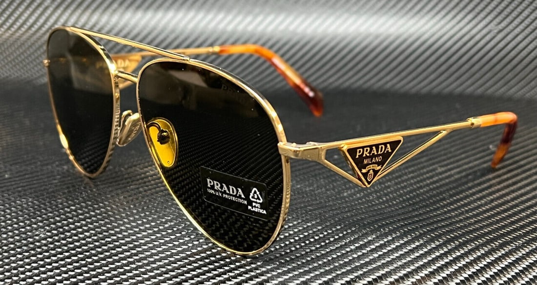 Prada PR 73ZS Gold Dark Brown Women's Sunglasses 58mm: Prada PR 73ZS Gold Dark Brown Women's Sunglasses 58mm Stylish PRADA PR 73ZS sunglasses featuring a luxurious gold and dark brown frame. These women's sunglasses have a lens width of 58 mm, making them