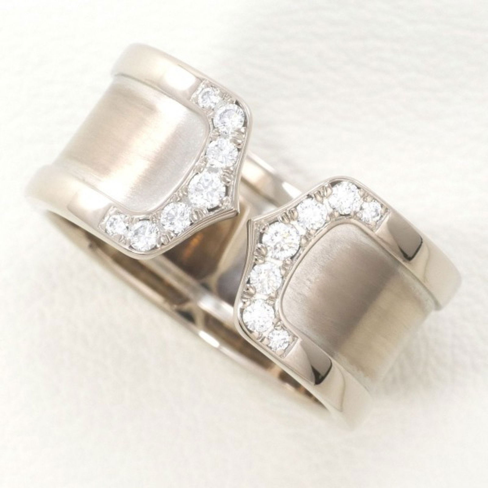 Cartier 18K White Gold Band Ring with Diamond: Cartier 18K White Gold Band Ring with Diamond Size (Non US) 16 Ring Size (Non US): 16 This exquisite band ring by Cartier is crafted from 18K white gold and features a diamond. Designed specifically f