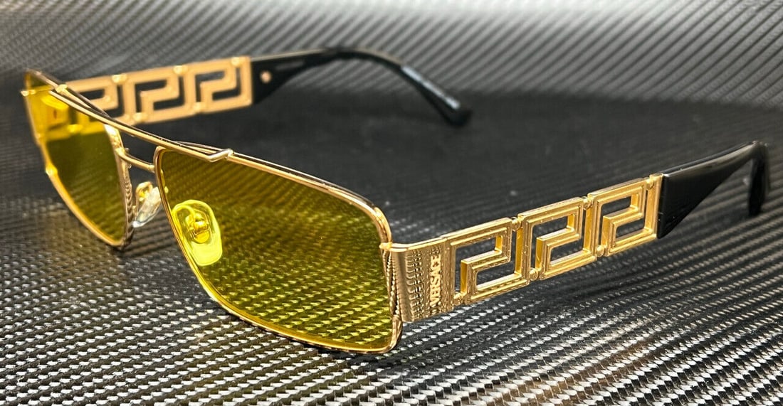 VERSACE VE2257 Gold Frame 60mm Men's Sunglasses: VERSACE VE2257 Gold Frame 60mm Men's Sunglasses Introducing the VERSACE VE2257 1002C9 Sunglasses, designed for men. These stylish sunglasses feature a striking gold frame color, perfect for adding a t