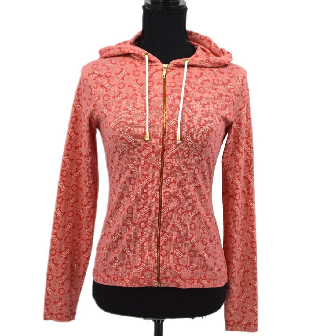 CELINE Red Long Sleeve T-Shirt with C Macadam Design Size M: CELINE Red Long Sleeve T-Shirt with C Macadam Design Size M This CELINE long sleeve top features a stylish front opening and is designed in a vibrant red color. Made from a comfortable blend of 88% co