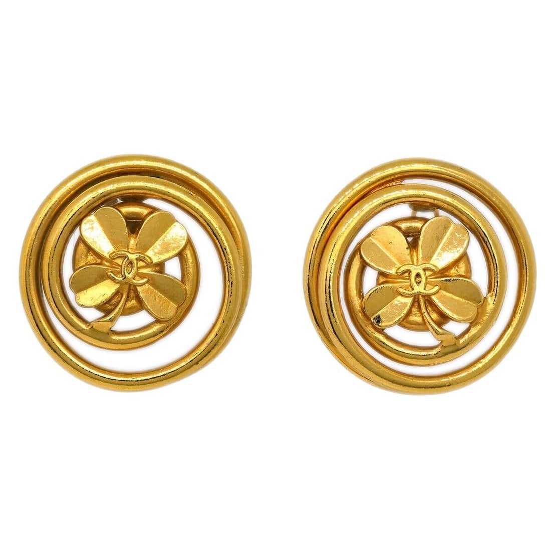 Chanel Gold-Plated Round Button Clover Clip-On Earrings: Chanel Gold-Plated Round Button Clover Clip-On Earrings These Chanel Button Clover Earrings feature a round shape and are designed with a clip-on closure for easy wear. The earrings are gold-plated, s