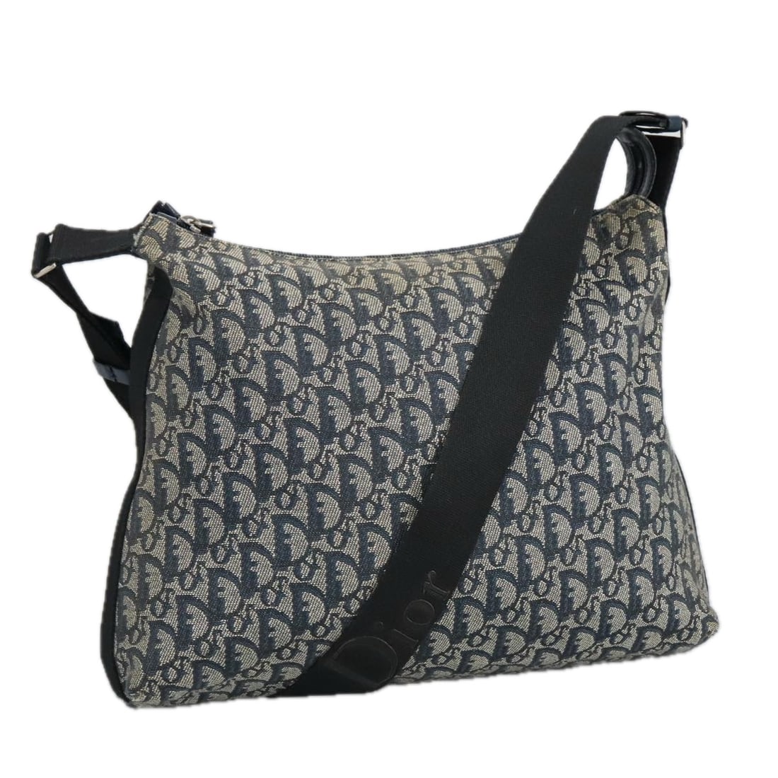Dior Trotter Navy Canvas Bag 35cm x 30cm x 10cm Italy: Dior Trotter Navy Canvas Bag 35cm x 30cm x 10cm Italy The Dior Trotter bag is a stylish accessory designed for women. It features a navy canvas material, providing a chic yet durable finish. The bag m