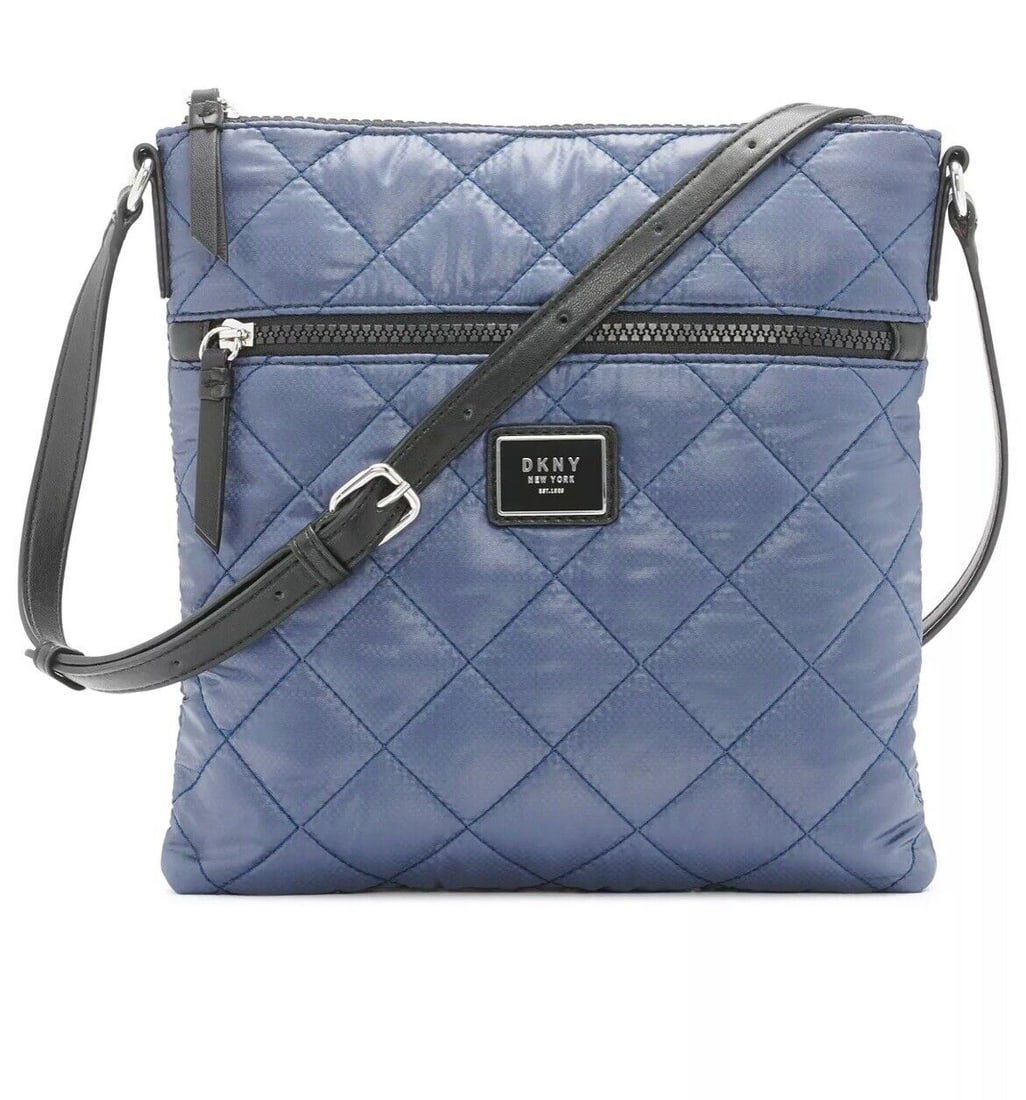 DKNY Maya Blue Quilted Nylon Large Crossbody Bag: DKNY Maya Blue Quilted Nylon Large Crossbody Bag This DKNY Maya Quilted Nylon Large Crossbody features a stylish blue exterior made from durable nylon material. It is designed as a crossbody style, pe
