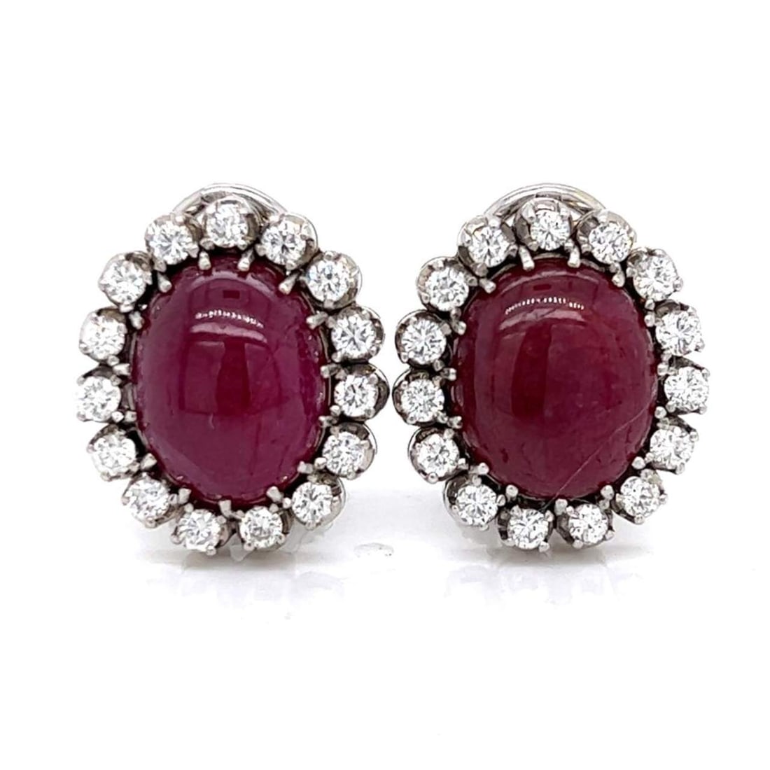 Exquisite Platinum Earrings with Rubies and Diamonds 5.00 Ct: Exquisite Platinum Earrings with Rubies and Diamonds 5.00 Ct These exquisite Platinum Ruby & Diamond Earrings are adorned with two oval-shaped rubies, approximately 5.00 Ct, complemented by a halo of 
