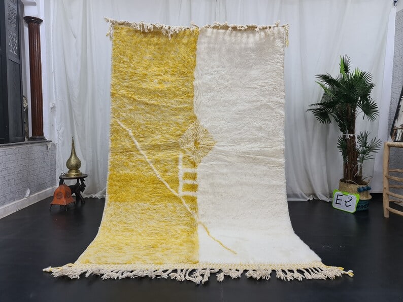 Handwoven Moroccan Soft Wool Rug 8x5 Feet Authentic Design: Handwoven Moroccan Soft Wool Rug 8x5 Feet Authentic Design Transform your living space with this Elegant Authentic Soft Wool Rug, handwoven in the Atlas Mountains by skilled local Berber women weavers
