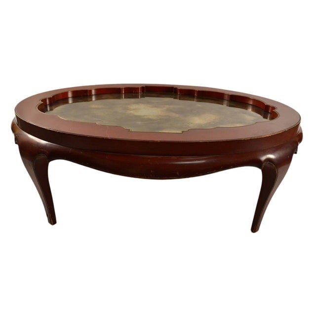 Vintage Samuel Marx Inspired Oval Coffee Table in Chinese Red: Vintage Samuel Marx Inspired Oval Coffee Table in Chinese Red This stunning oval cocktail coffee table is a vintage piece inspired by the renowned designer Samuel Marx. Crafted in a Chinese style with