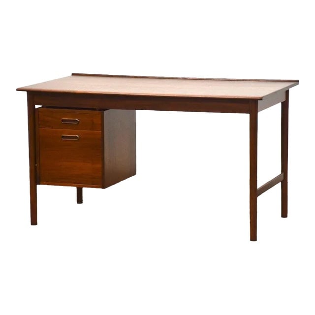 1960s Danish Modern Teak Desk with Two Drawers and Finished Back: 1960s Danish Modern Teak Desk with Two Drawers and Finished Back This vintage 1960s Danish Modern teak desk combines style and functionality with its elegant design and practical features. It includes