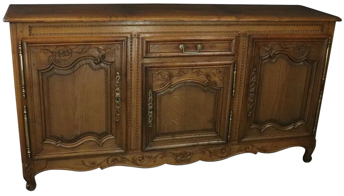 Rustic Antique French Normandy Sideboard in Walnut: Rustic Antique French Normandy Sideboard in Walnut Elevate your home's interior with this antique French Normandy sideboard a perfect blend of function and style. Crafted in France around 1890 this si