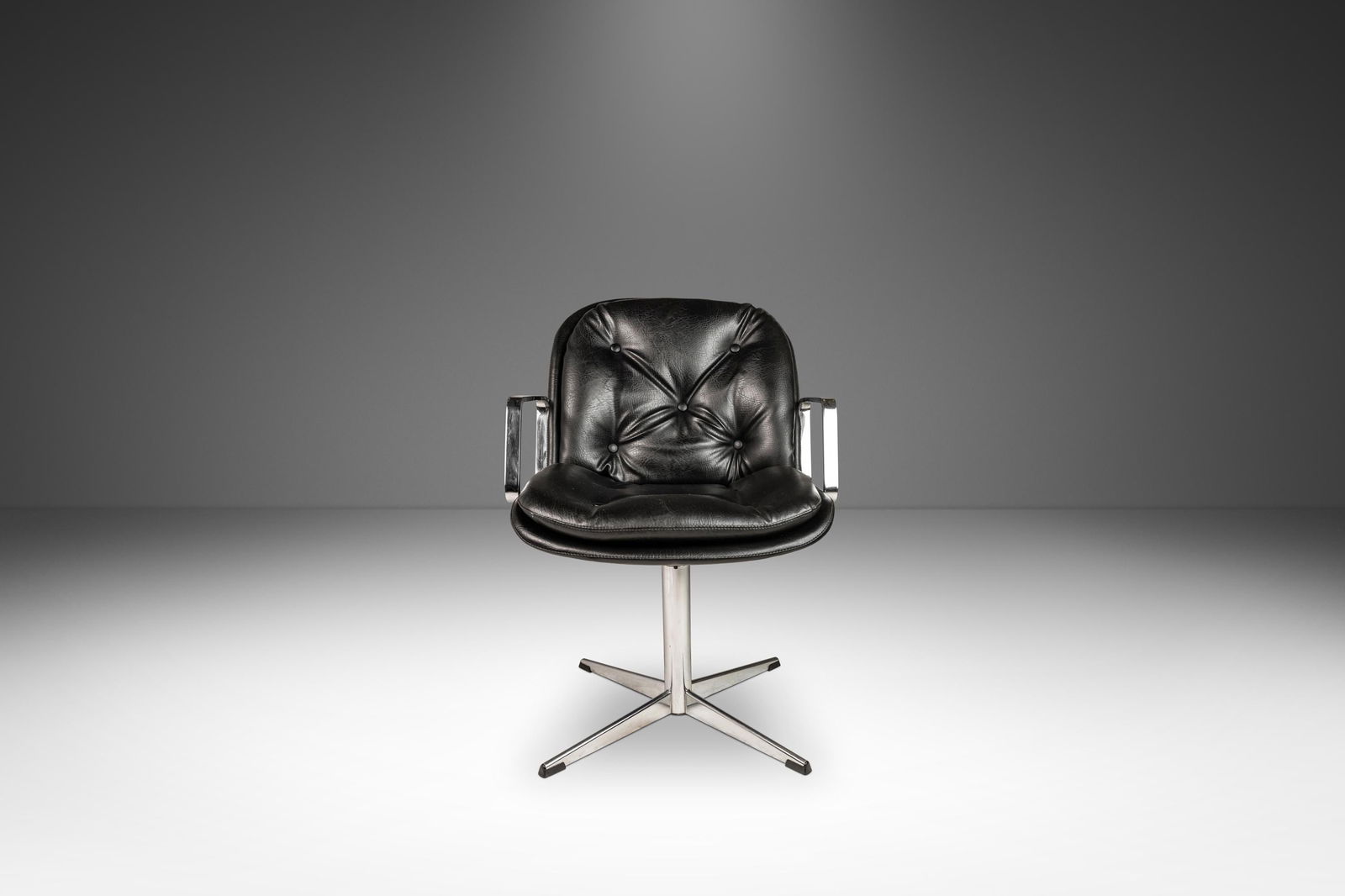 Mid-Century Modern High-Stance Office Chair in Chrome and Black Vinyl: Mid-Century Modern High-Stance Office Chair in Chrome and Black Vinyl Embrace the elegance of Mid-Century Modern design with this High-Stance Office Chair, inspired by Charles Pollock, crafted in the