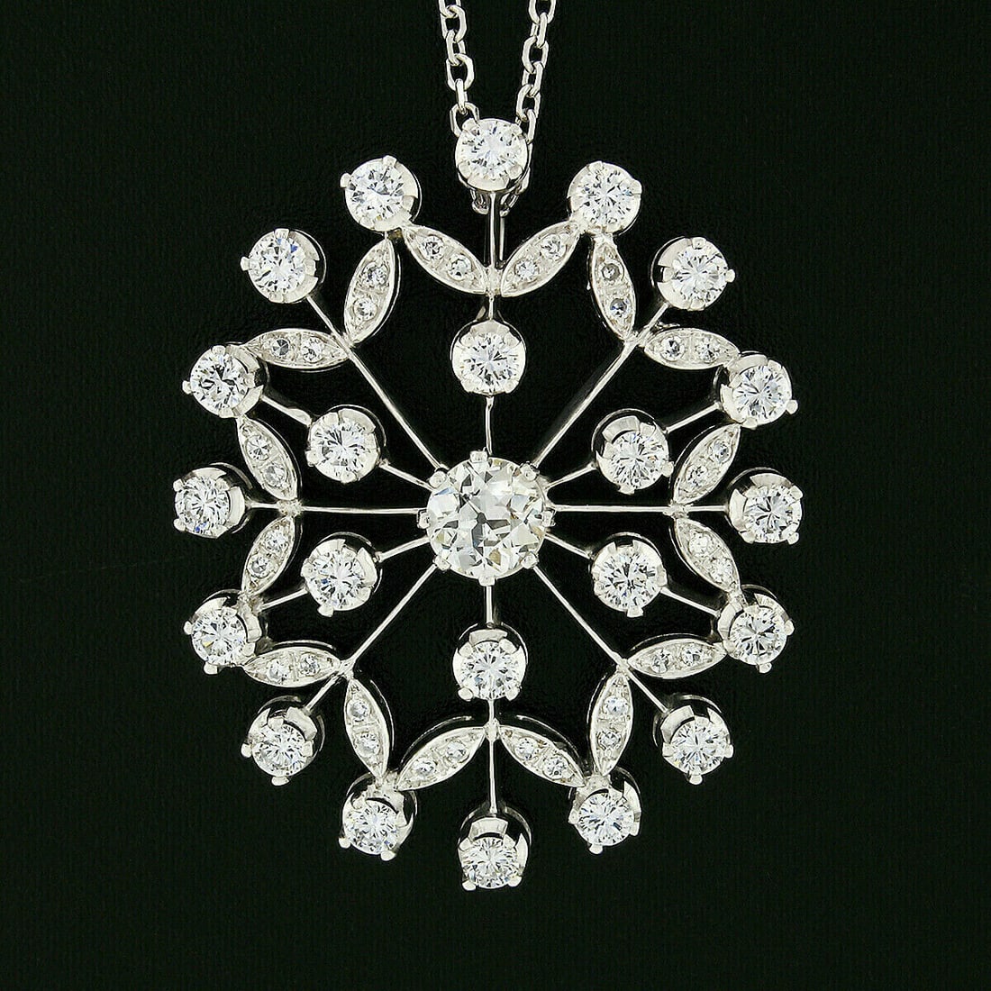 Vintage 18k White Gold 3.05ctw Old European Diamond Snowflake Pendant Necklace: Vintage 18k White Gold 3.05ctw Old European Diamond Snowflake Pendant Necklace This exquisite vintage pendant necklace showcases a stunning floral snowflake design crafted from solid 18k white gold. A