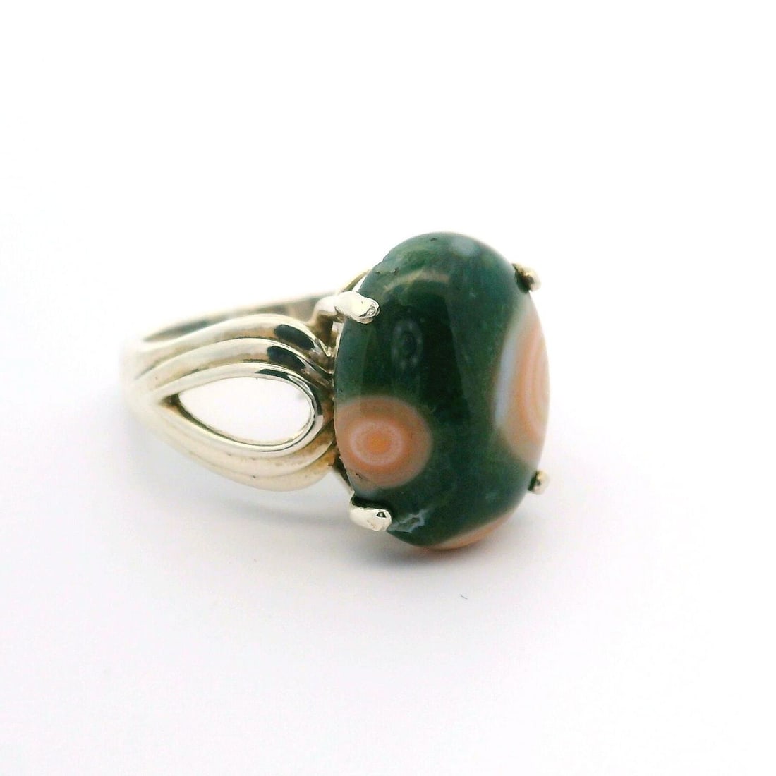 Sterling Silver Green Jasper Ring with Open Work Sides 6.5: Sterling Silver Green Jasper Ring with Open Work Sides 6.5 This exquisite ring features a natural genuine green jasper cabochon, prong set in a beautiful sterling silver design. The oval cabochon meas