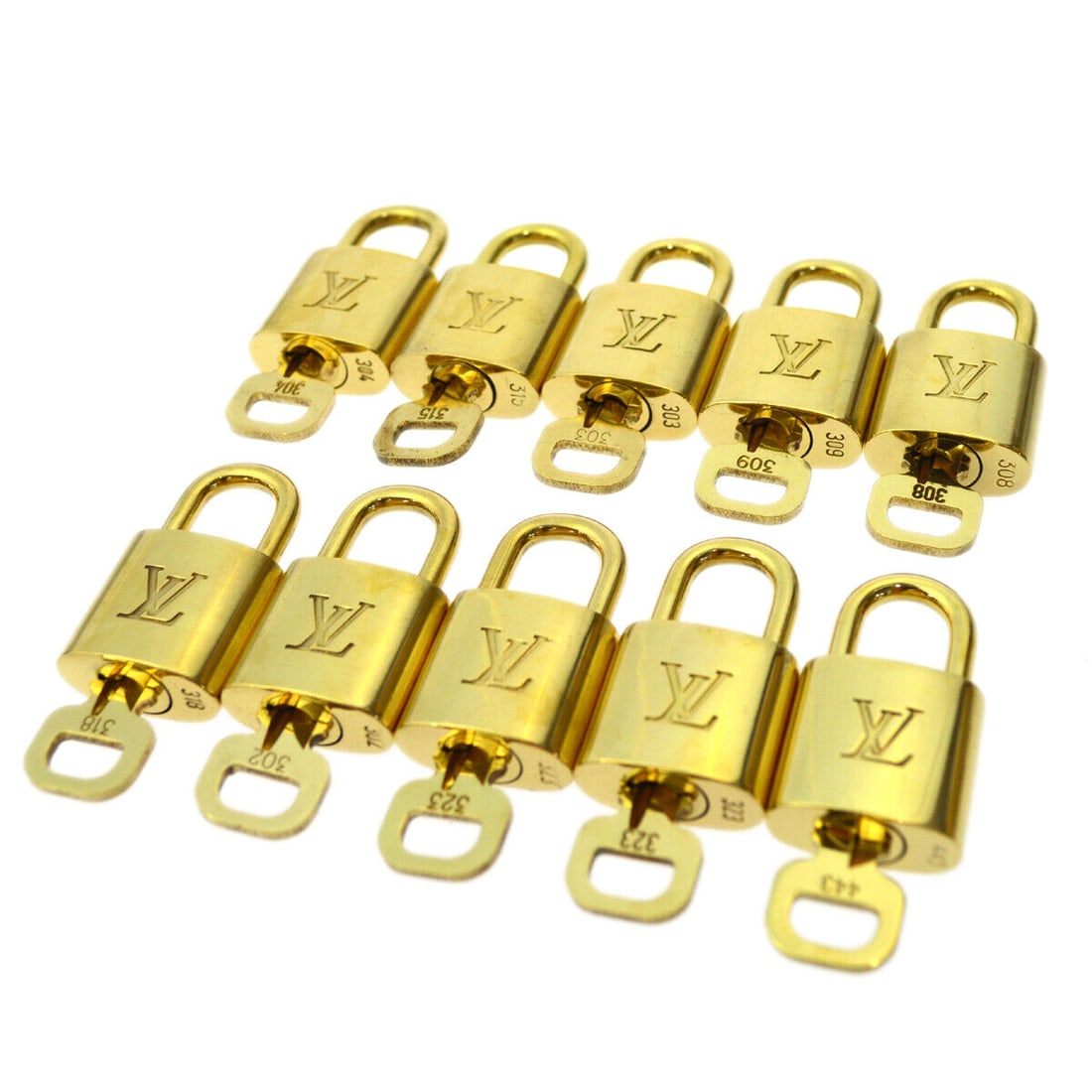 Louis Vuitton Gold Padlock and Key 10 Piece Charm Set: Louis Vuitton Gold Padlock and Key 10 Piece Charm Set This offering features a 10 Piece Set of Louis Vuitton Padlock & Key Bag Accessories Charm in gold. The item type is a padlock, and it showcases a