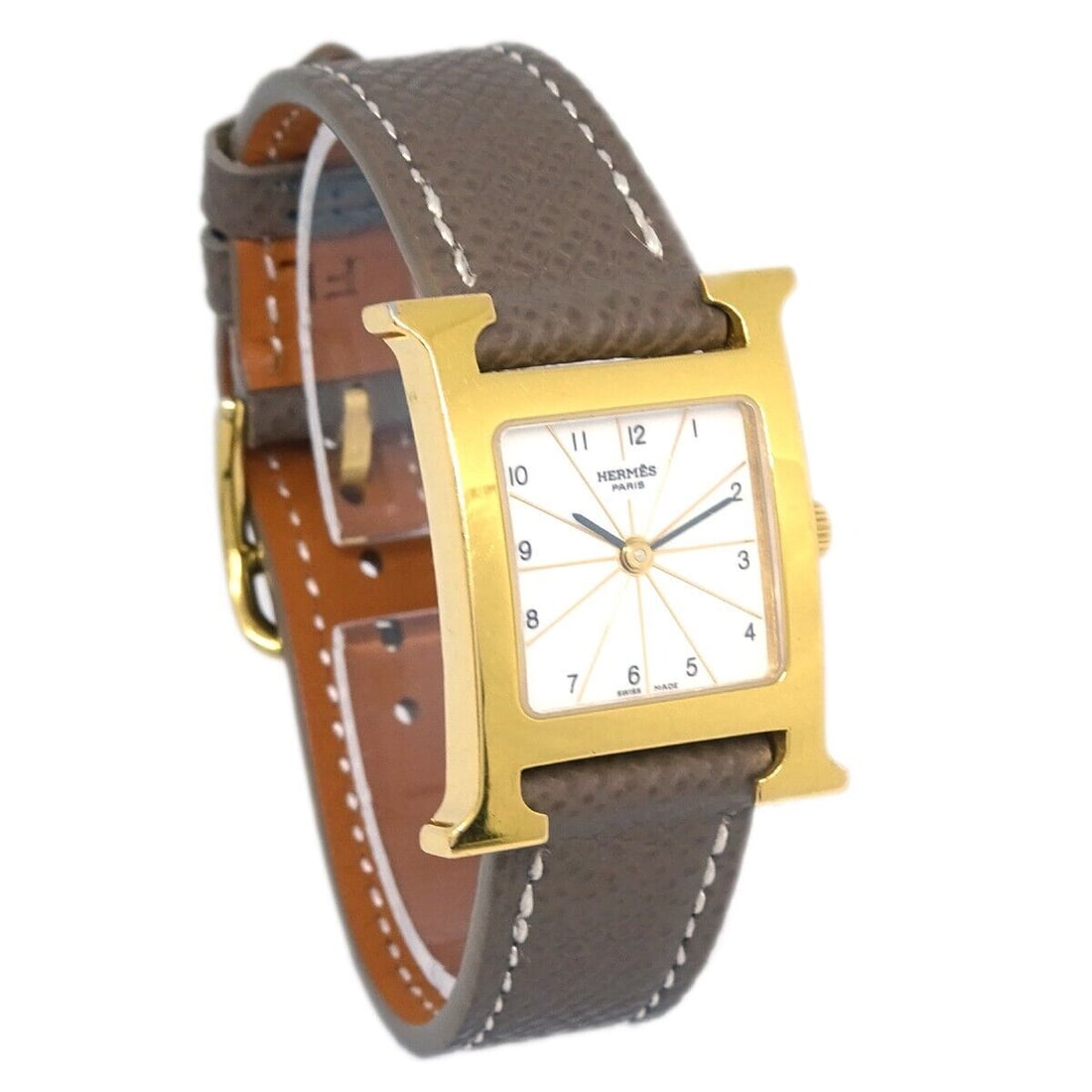 Hermes HH1.201 H Quartz Wristwatch Brown Leather Band Gold Case 20mm: Hermes HH1.201 H Quartz Wristwatch Brown Leather Band Gold Case 20mm This Hermes Ref.HH1.201 H Watch PM features a Quartz movement and an elegant buckle band crafted from brown leather. The case is ma