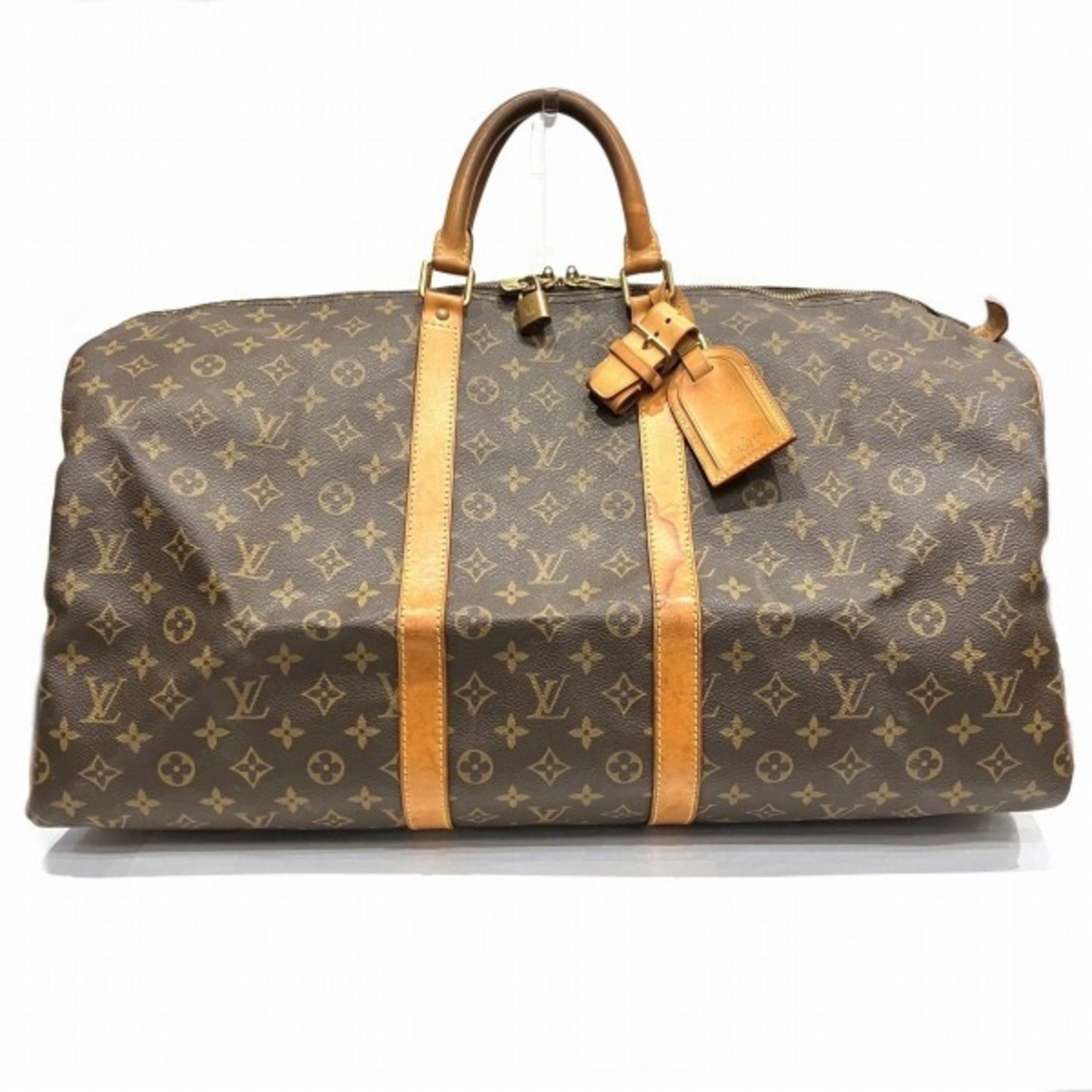 Louis Vuitton Keepall 55 Travel Bag Brown Canvas 55cm: Louis Vuitton Keepall 55 Travel Bag Brown Canvas 55cm The Louis Vuitton Keepall 55 is a versatile travel bag featuring a classic brown canvas exterior. This unisex bag measures W 55 cm x H 34 cm x D 2