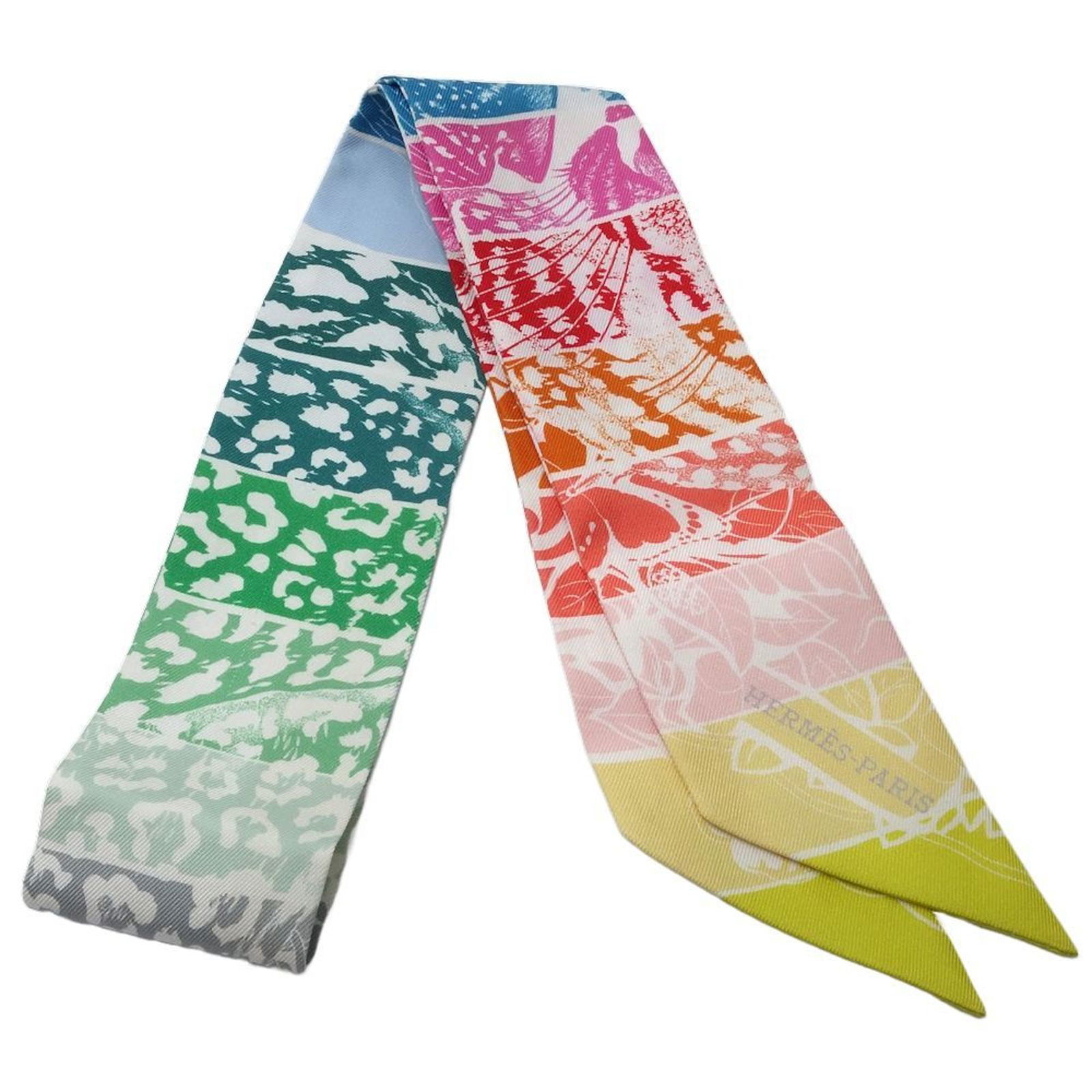 Hermes Twilly Scarf Jungle Love Rainbow Multi-Color Silk 86cm: Hermes Twilly Scarf Jungle Love Rainbow Multi-Color Silk 86cm This Hermes Twilly scarf features a vibrant Jungle Love Rainbow design, making it a stunning accessory for women. Crafted from high-qualit