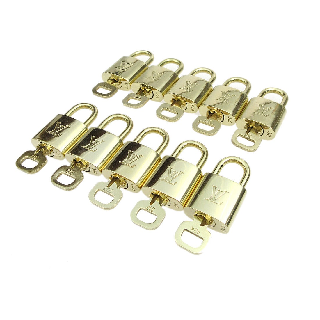 Louis Vuitton Gold Padlock and Key Charm 10 Piece Set: Louis Vuitton Gold Padlock and Key Charm 10 Piece Set This listing features a 10-piece set of Louis Vuitton padlock and key bag accessories charm in gold. The type of the item is a padlock, and it is 