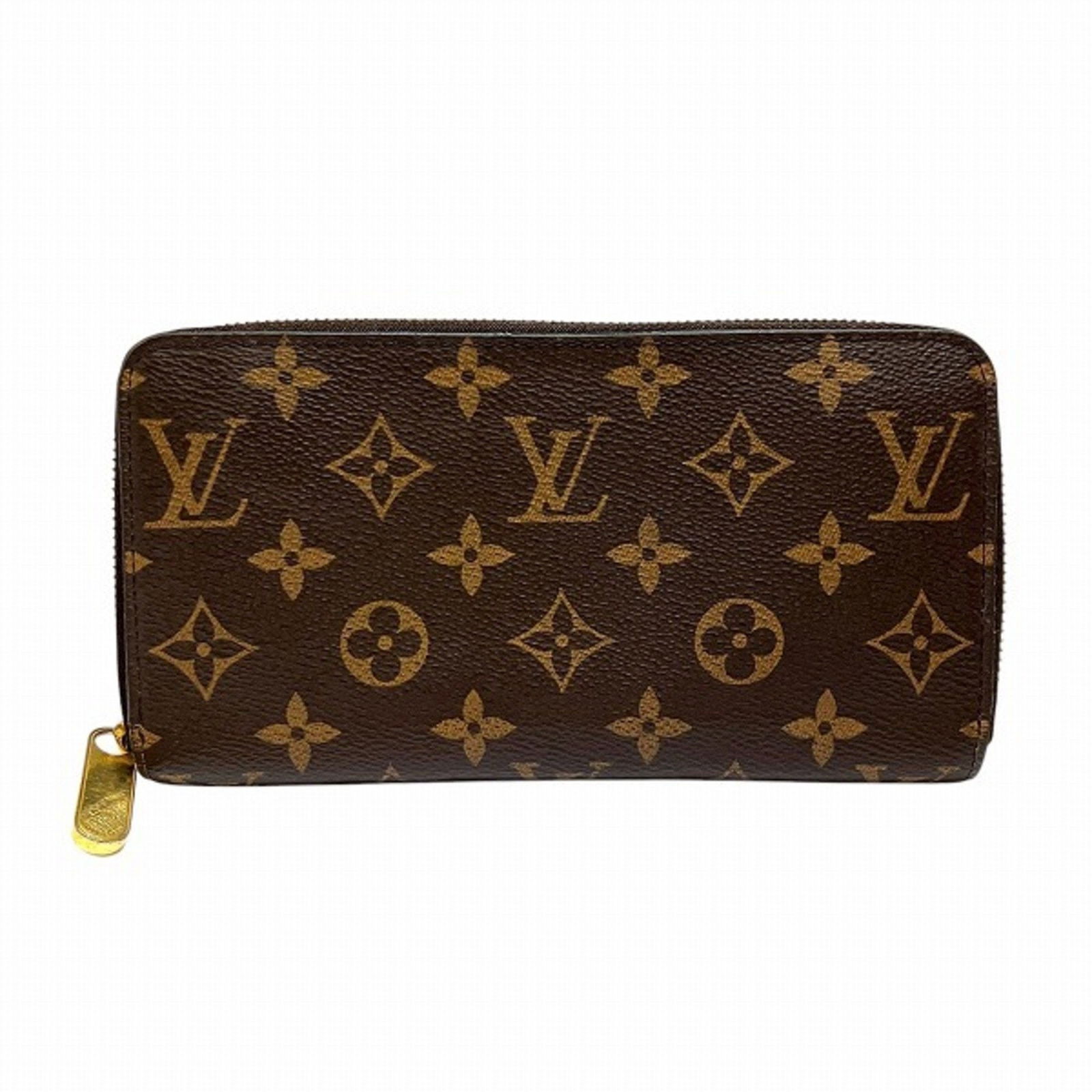 Louis Vuitton Monogram Long Wallet M42616 for Men and Women: Louis Vuitton Monogram Long Wallet M42616 for Men and Women Experience luxury and functionality with this Louis Vuitton Monogram Zippy Wallet. Designed for both men and women, this long bi-fold wallet