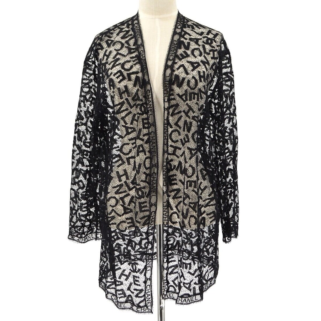 Chanel Lace Cardigan Black 40: Chanel Lace Cardigan Black 40 Elevate your wardrobe with this Chanel Lace Cardigan in classic black. This regular-sized cardigan features long sleeves and an elegant open front design, perfect for lay