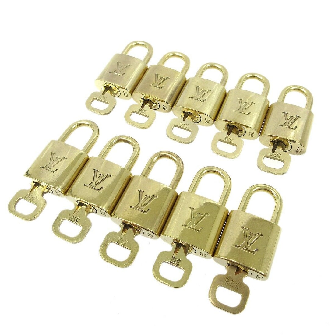 Louis Vuitton Gold Padlock & Key Charm Accessories Set: Louis Vuitton Gold Padlock & Key Charm Accessories Set Enhance your collection with this stunning 10-piece set of Louis Vuitton padlocks and keys, crafted in a luxurious gold tone. Each padlock featur