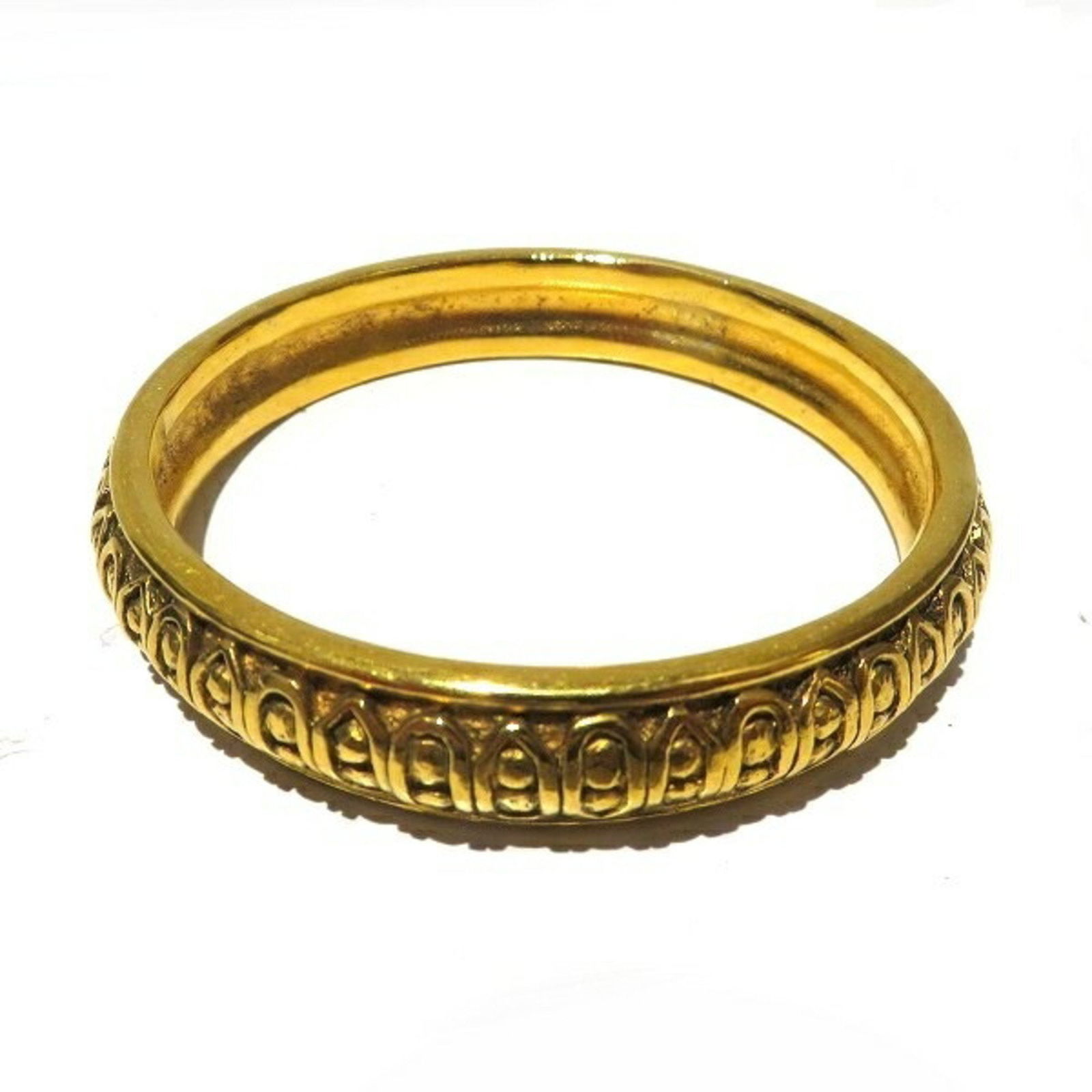 Coco Mark Gold Bangle for Women: Coco Mark Gold Bangle for Women Elevate your accessory collection with this stunning Chanel Coco Mark Gold Bangle crafted for women. This exquisite piece features intricate detailing around the outer