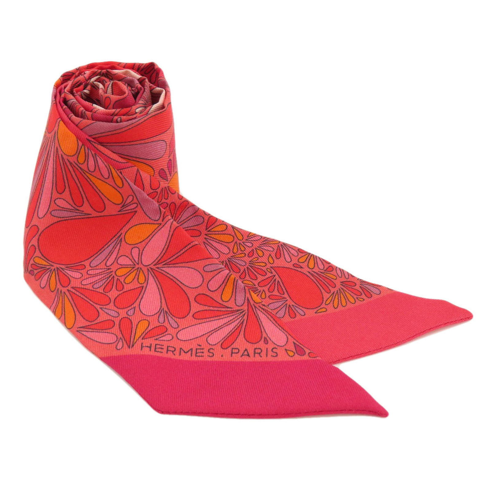 Red Silk Twilly Scarf for Women: Red Silk Twilly Scarf for Women The Hermes Twilly Scarf is a luxurious accessory crafted from high-quality silk, designed specifically for women. This elegant scarf showcases a vibrant red color, comp