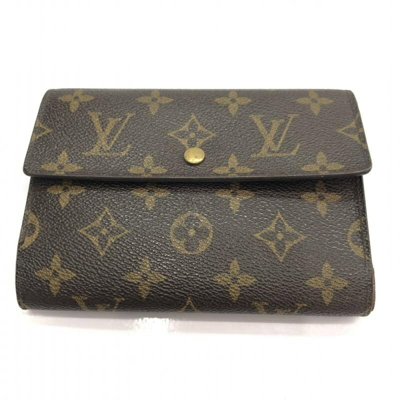 Louis Vuitton Monogram Porto Tresor Wallet M61202: Louis Vuitton Monogram Porto Tresor Wallet M61202 This Louis Vuitton Monogram Porto Tresor Wallet (Model M61202) is a stunning accessory crafted from the iconic Monogram canvas. The wallet features a 
