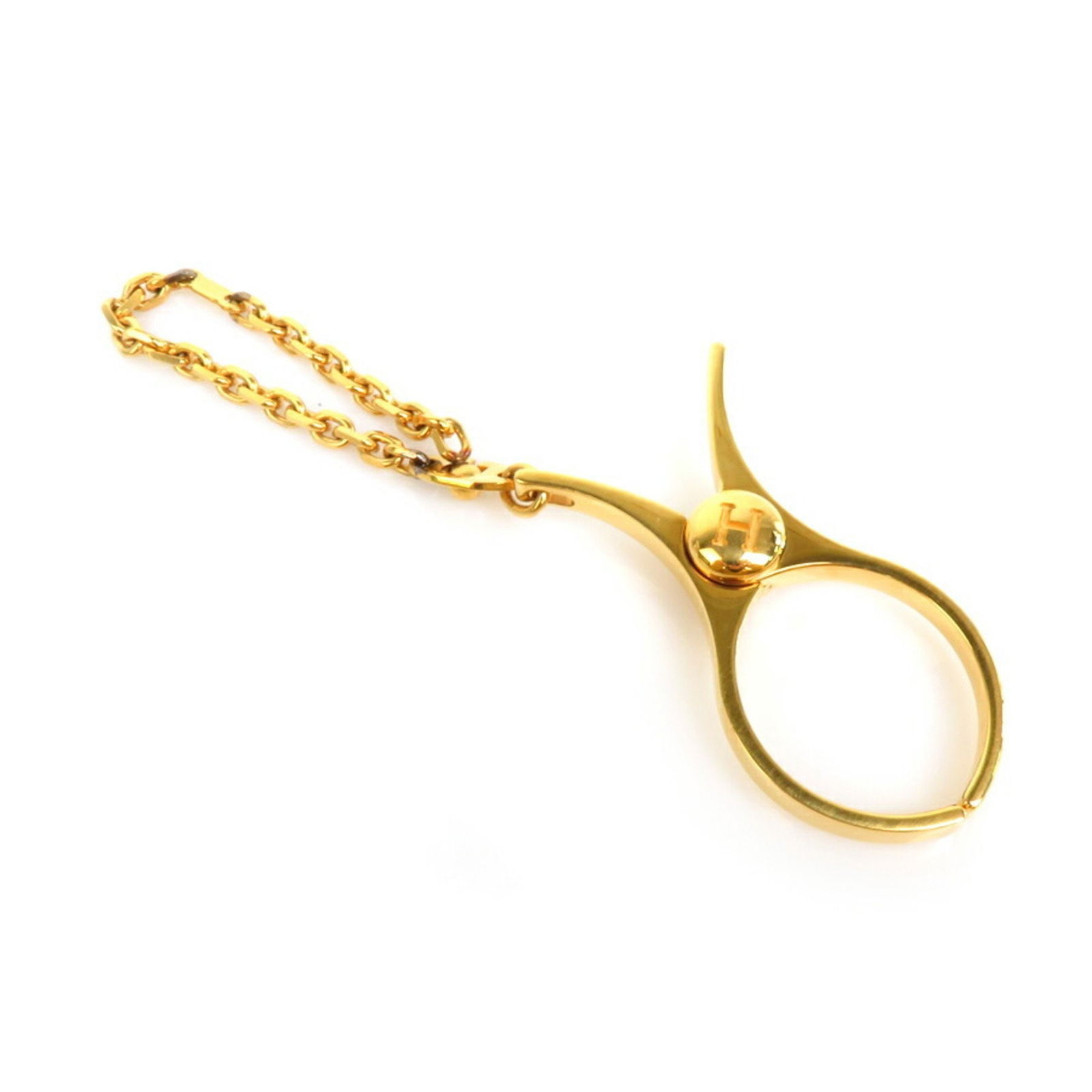 Hermes Gold Metal Scissor Charm Holder 60mm Unisex: Hermes Gold Metal Scissor Charm Holder 60mm Unisex This exquisite Hermes charm glove holder features a striking gold-tone metal design, shaped like a pair of scissors, making it a stylish accessory fo