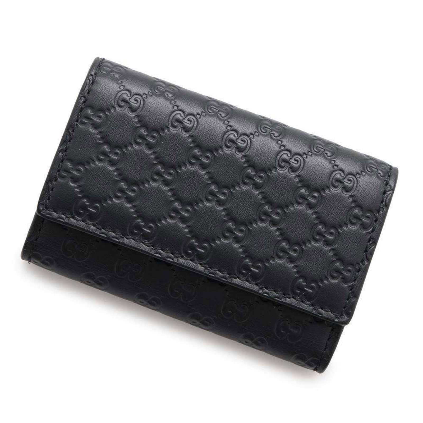 Gucci Black Leather Key Case Micro Guccissima 9.5cm x 6.5cm: Gucci Black Leather Key Case Micro Guccissima 9.5cm x 6.5cm This Gucci Key Case features a sleek black leather construction adorned with an embossed Micro Guccissima pattern, showcasing the iconic int