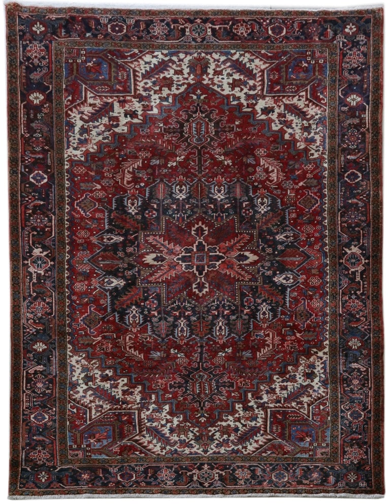 8' x 11' Rust Red Persian Heriz Rug: 8' x 11' Rust Red Persian Heriz Rug This handcrafted Persian Heriz rug features intricate traditional designs in a stunning rust red color, beautifully complemented by shades of blue and cream. With a